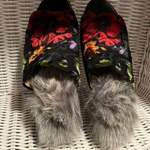 Gunmetal brand fur slides with floral design.